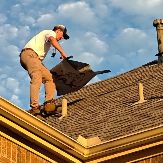 StormVets team member performing an emergency roof repair in Allen