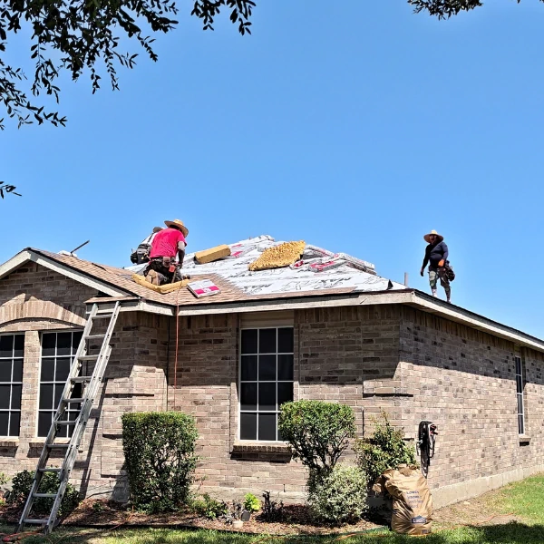 Crew installing class 4 impact resistant shingles provided by GAF in Wylie, TX
