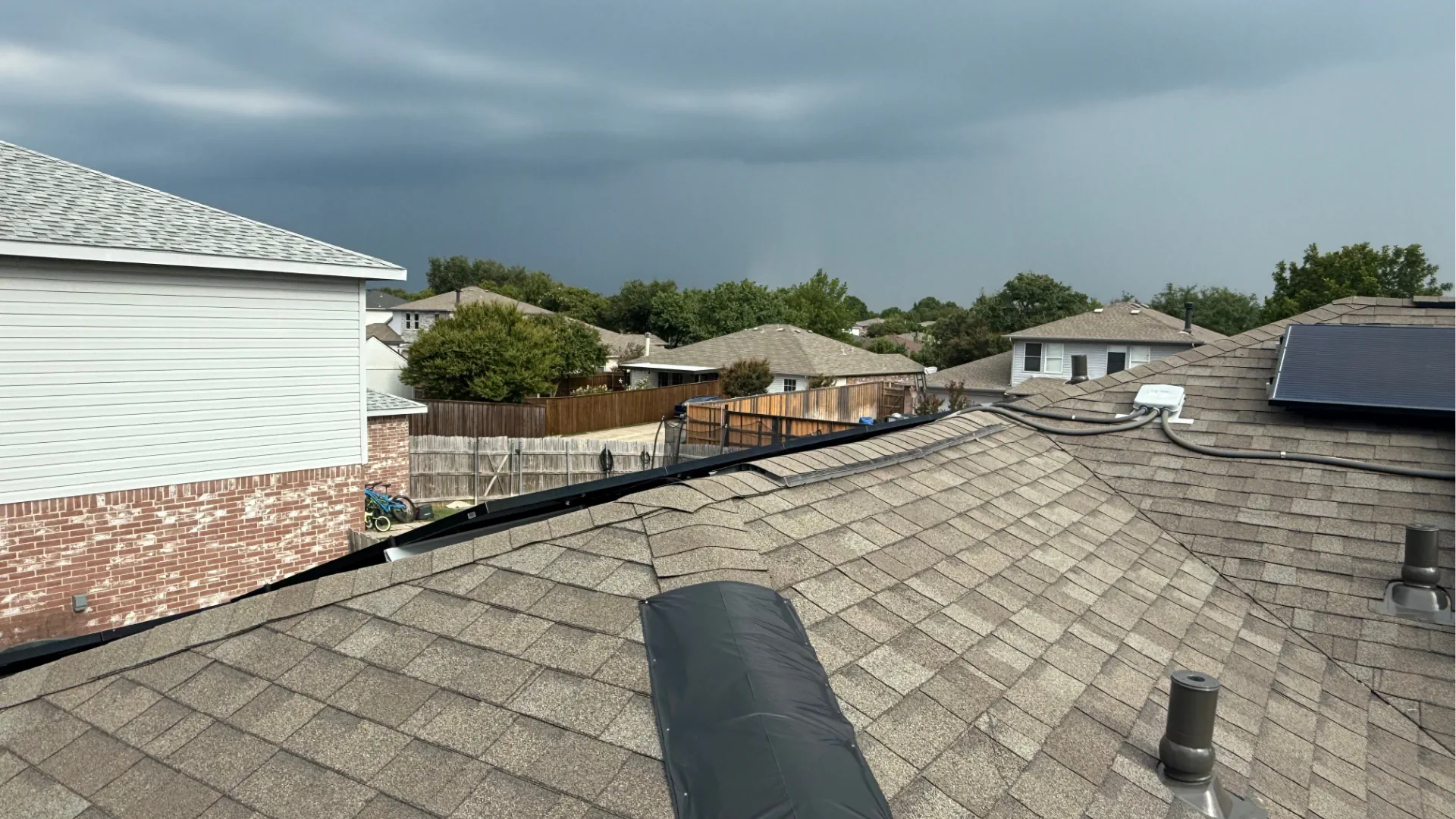 Emergency roof repair and tarping of one of the ridges on a customer roof