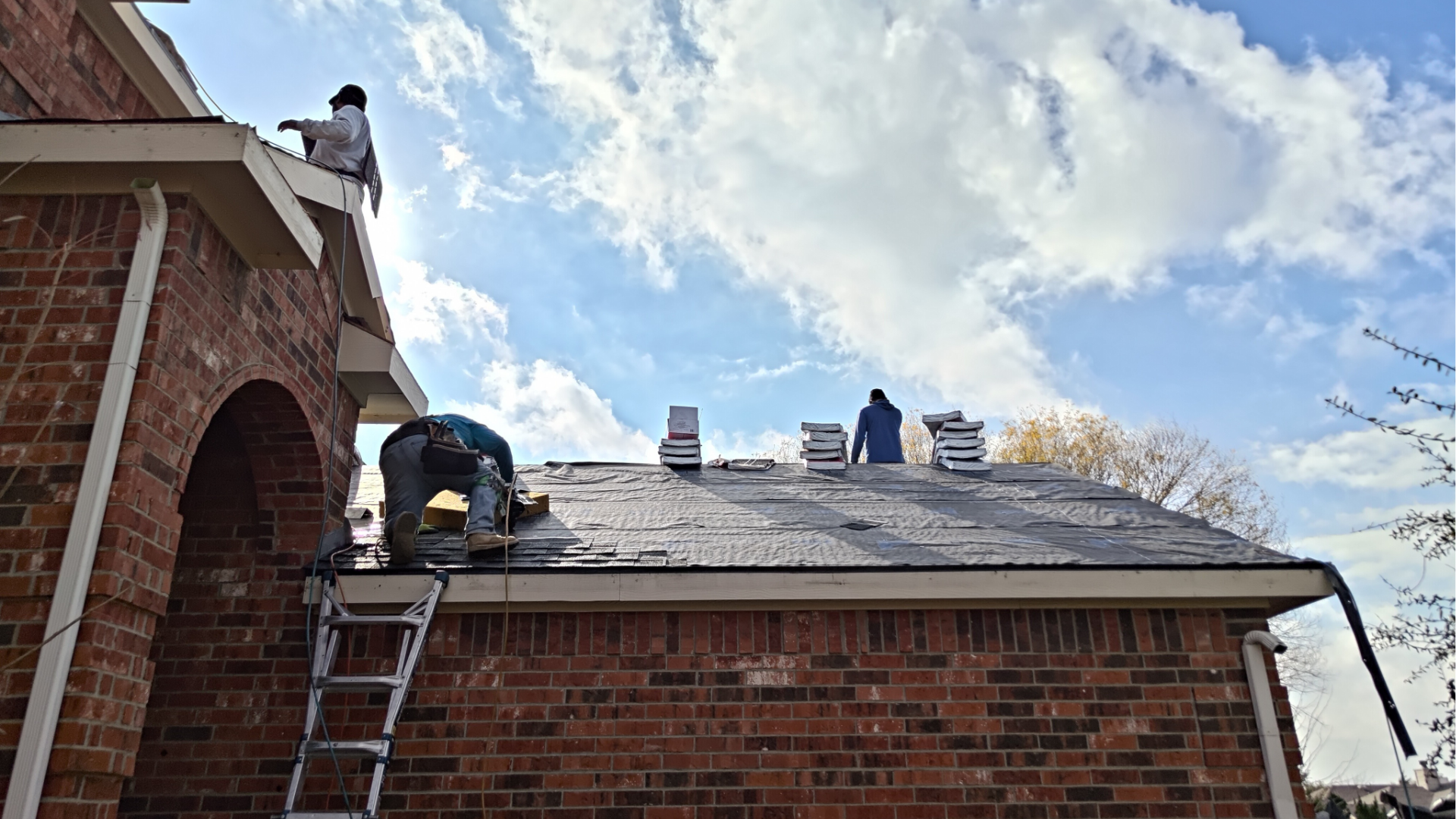 Synthetic underlayment install on a roof contact us now
