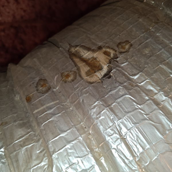 Close up of rat urine or rodent activity on AC duct in the attic
